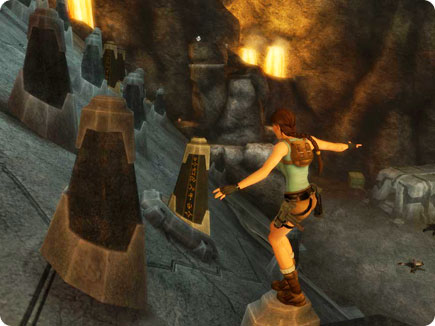 Lara balancing on a pedestal.